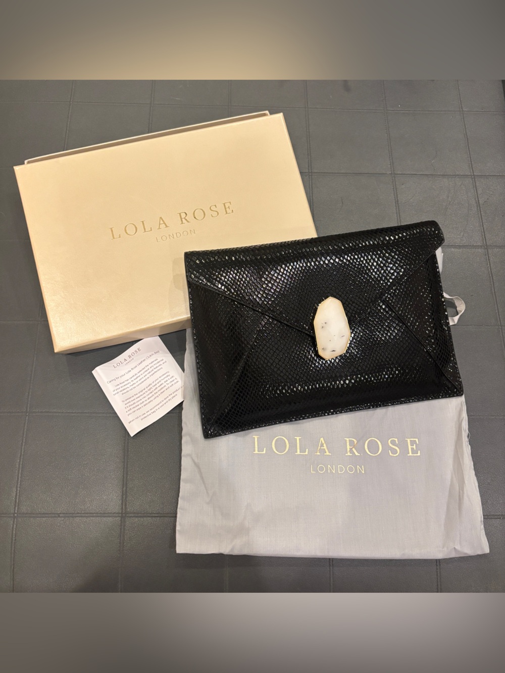 Lola Rose of London never used black leather snake embossed clutch with stone.